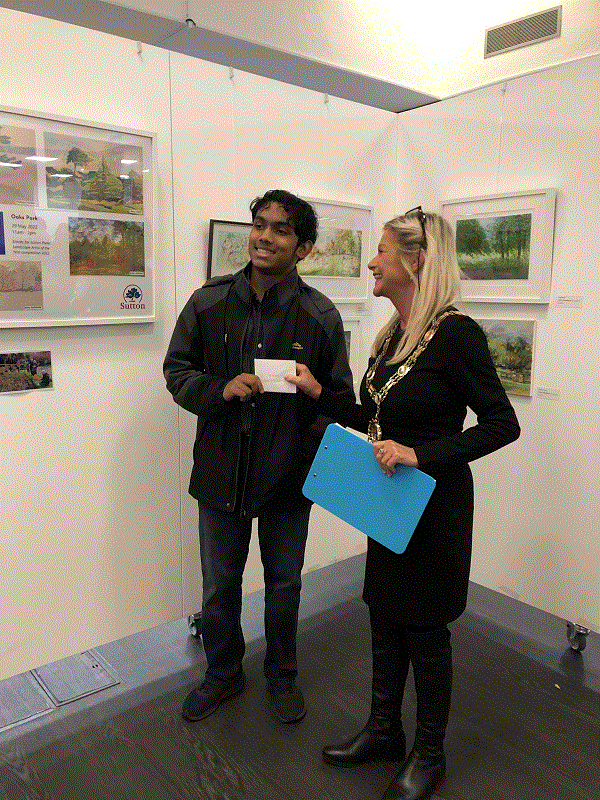 Aryan Rajesh receiving his Award from the Mayor